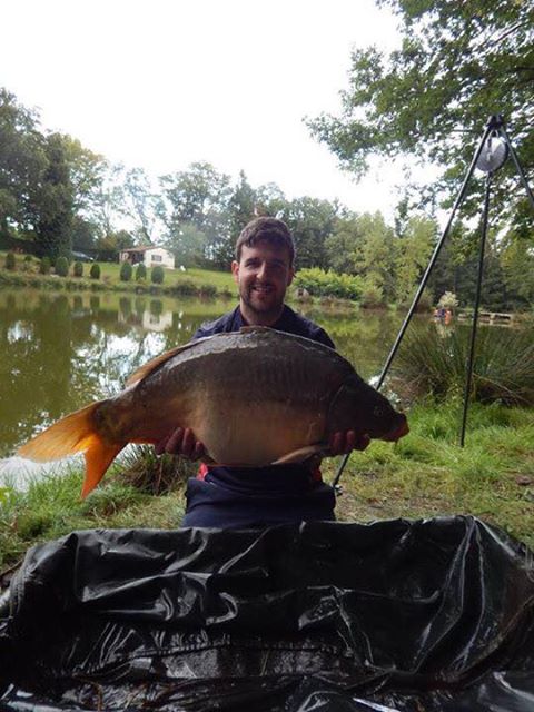 Mirror carp in the cradle at The Cabin Lake