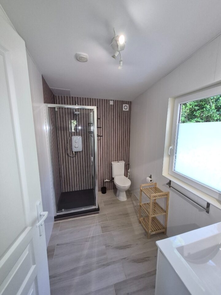 Modern bathroom with shower in the lakeside cabin at The Cabin Lake