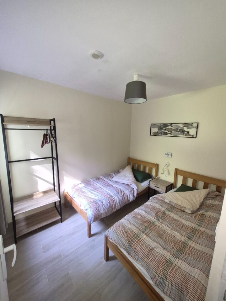 Twin bedroom in the lakeside cabin at The Cabin Lake, Nantiat