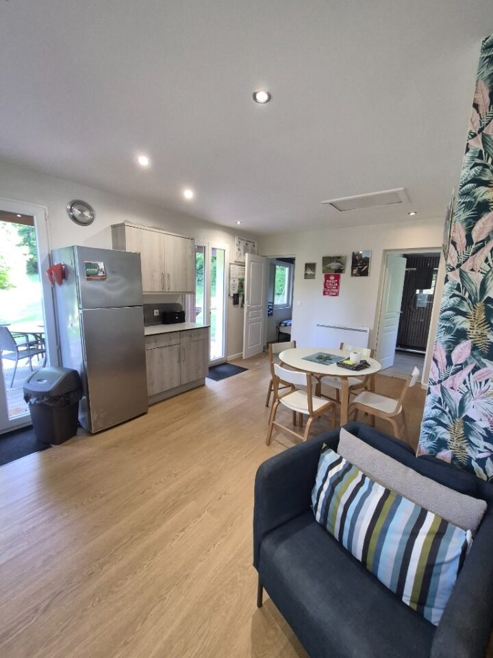 Living and kitchen area of the lakeside cabin at The Cabin Lake