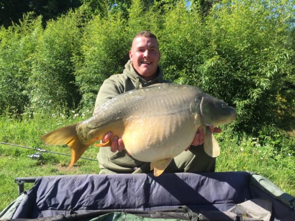 Large mirror carp caught at Lodge Lakes French carp fishing holiday